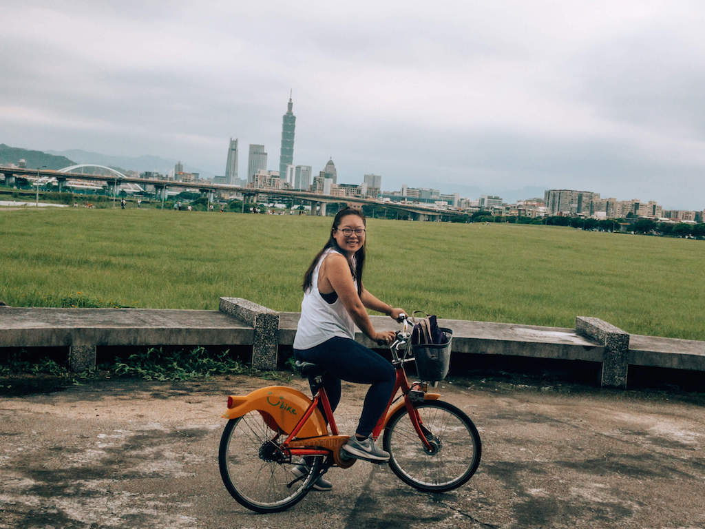 View of Songshan and Taipei 101 in the back. Tina on a Ubike in Taipei
